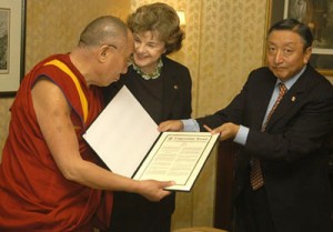 Senator Feinstein presents a copy of Senate Resolution 212 to His Holines the Dalai Lama.