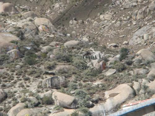 Police and soldiers were seen gathered on the hillside beside Drepung