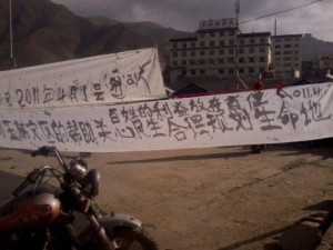 banners hung by protesters in Kyegu