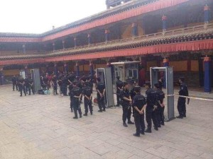 Police man the security gates at Kumbum monastery