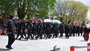 two dozen heavily-armed police