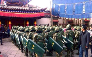 Troops with riot shields gathering at Kumbum for the Monlam prayer festival