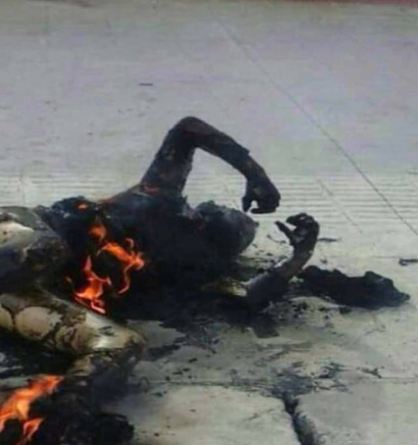 The body of a woman who self-immolated in a town center in Ngaba (Chinese: Aba).