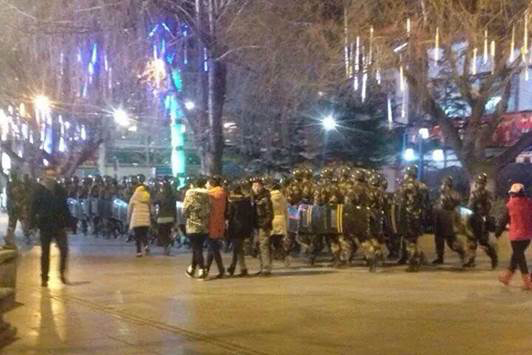 Troops in riot gear patrol in Lhasa on December 15.