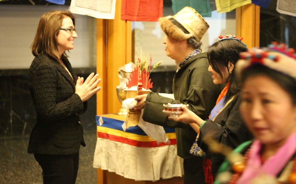 US Special Coordinator for Tibetan Issues participating in a traditional Tibetan New Year ritual at the beginning of the State Department Losar reception.