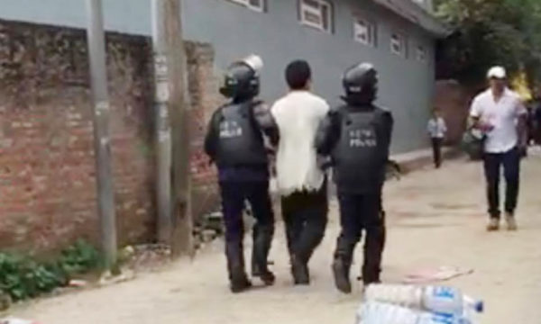 Tibetan being detained by Nepalese police