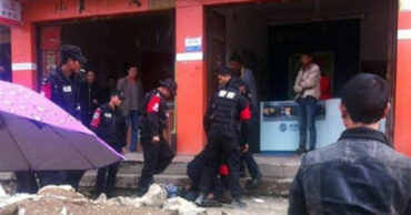 Police detain a Tibetan protester