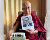 Dalai Lama holds photo