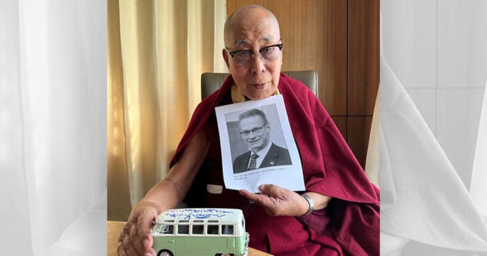 Dalai Lama holds photo