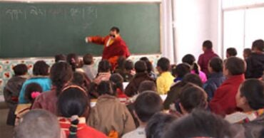 Hungkar Dorje teaches in school